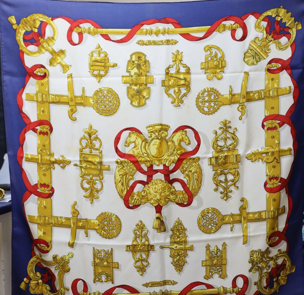 A Hermes The Queens Silver Jubilee 1977 silk scarf together with another signed by C De Savigny